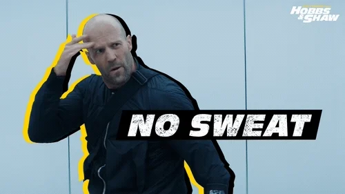 Jason Statham wiping sweat from his brow